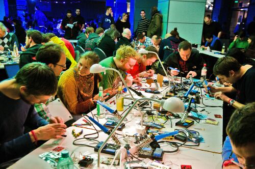 Room full of happy hardware hackers at the Hardware Hacking Area at 30C3